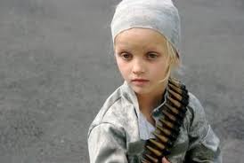 This little one is a child soldier. Young, yes. Willing, no.
