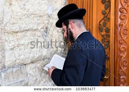 Jews pray at the wailing wall for peace, kindness and for their families