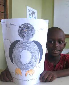 A boy and his penguin. (Photo: Facebook)
