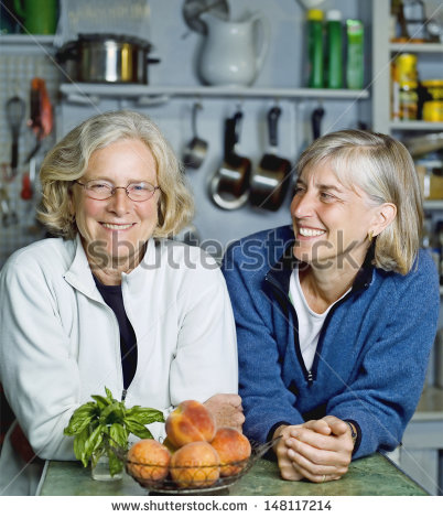 stock-photo-smiling-senior-women-leaning-at-kitchen-counter-148117214