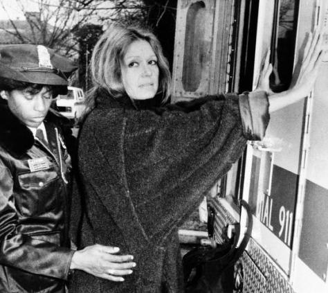 A uniformed officer arrests feminist Gloria Steinem during an anti-apartheid protest outside the South African Embassy in Washington, Dec. 19, 1984. (AP Photo/Pool)