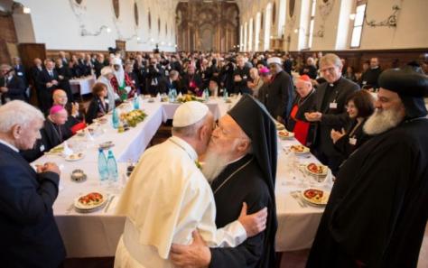 Pope Francis (L) hugs Ecumenical Patriarch Bartholomew I (R) during the inter-religious meeting "Prayer for Peace" in Assisi, Italy, September 20, 2016. Osservatore Romano/Handout via Reuters