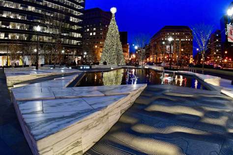 People look at a Christmas tree at CityCenterDC in downtown Washington on December 04. Getty